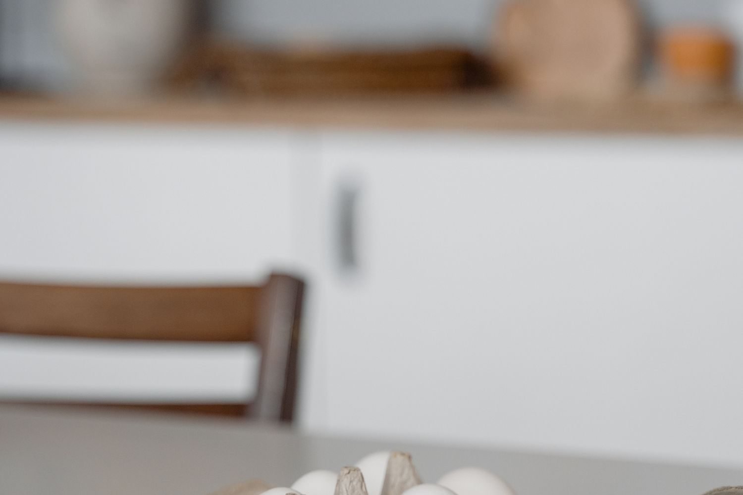 Protein-rich foods including eggs, lentils, paneer, chicken breast and Greek yogurt arranged on a table
