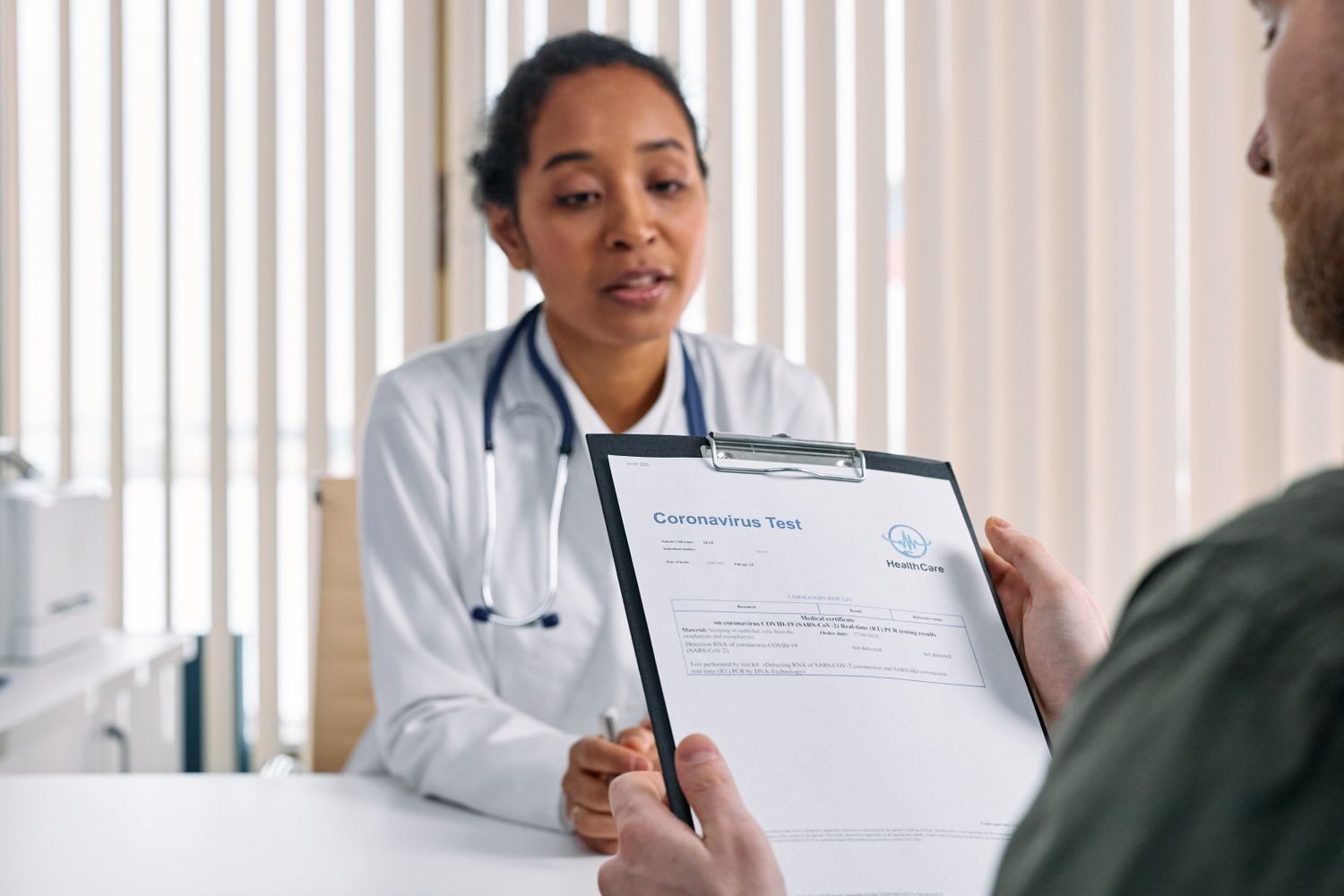 Doctor consulting with a patient about gastritis symptoms and H. pylori testing