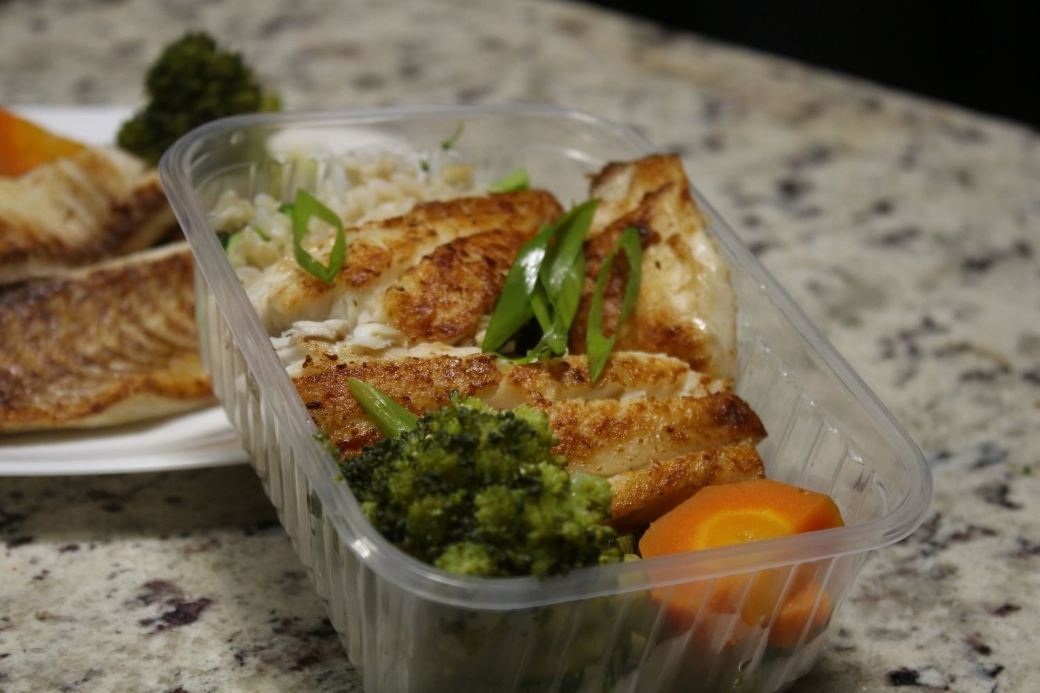 Woman meal prepping PCOS-friendly containers with grilled protein, brown rice, and vegetables for the week