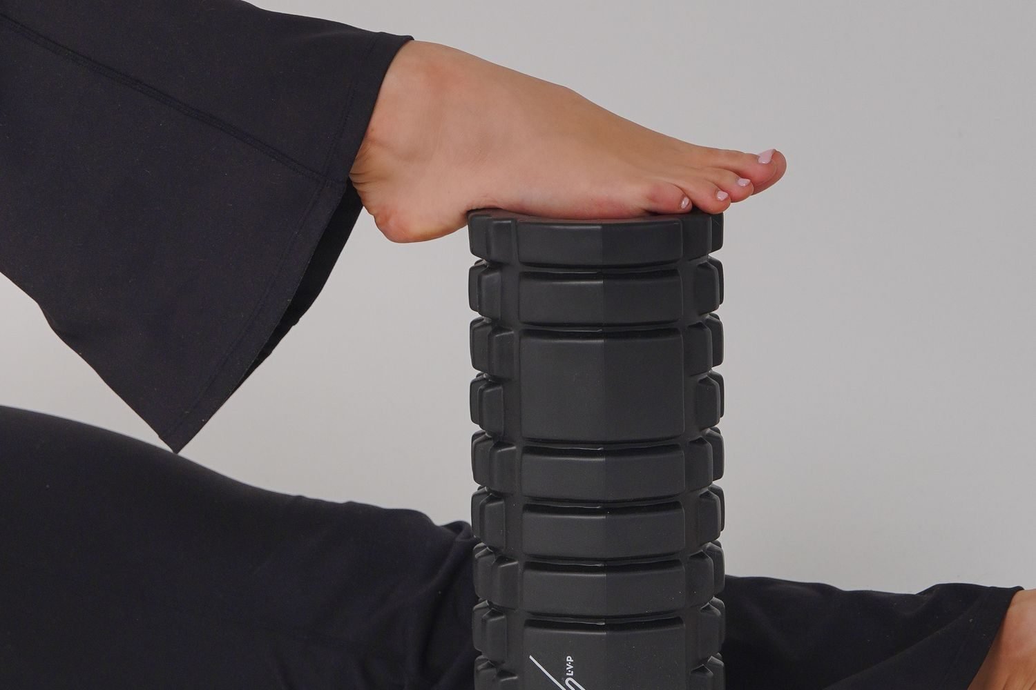 Foot resting on a foam roller for leg recovery