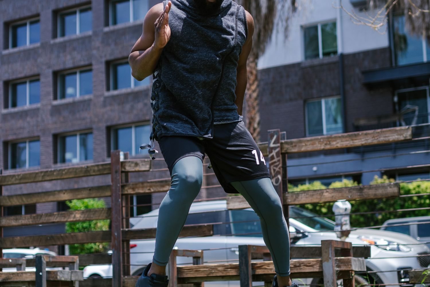 Person performing quick footwork through an agility ladder drill outdoors
