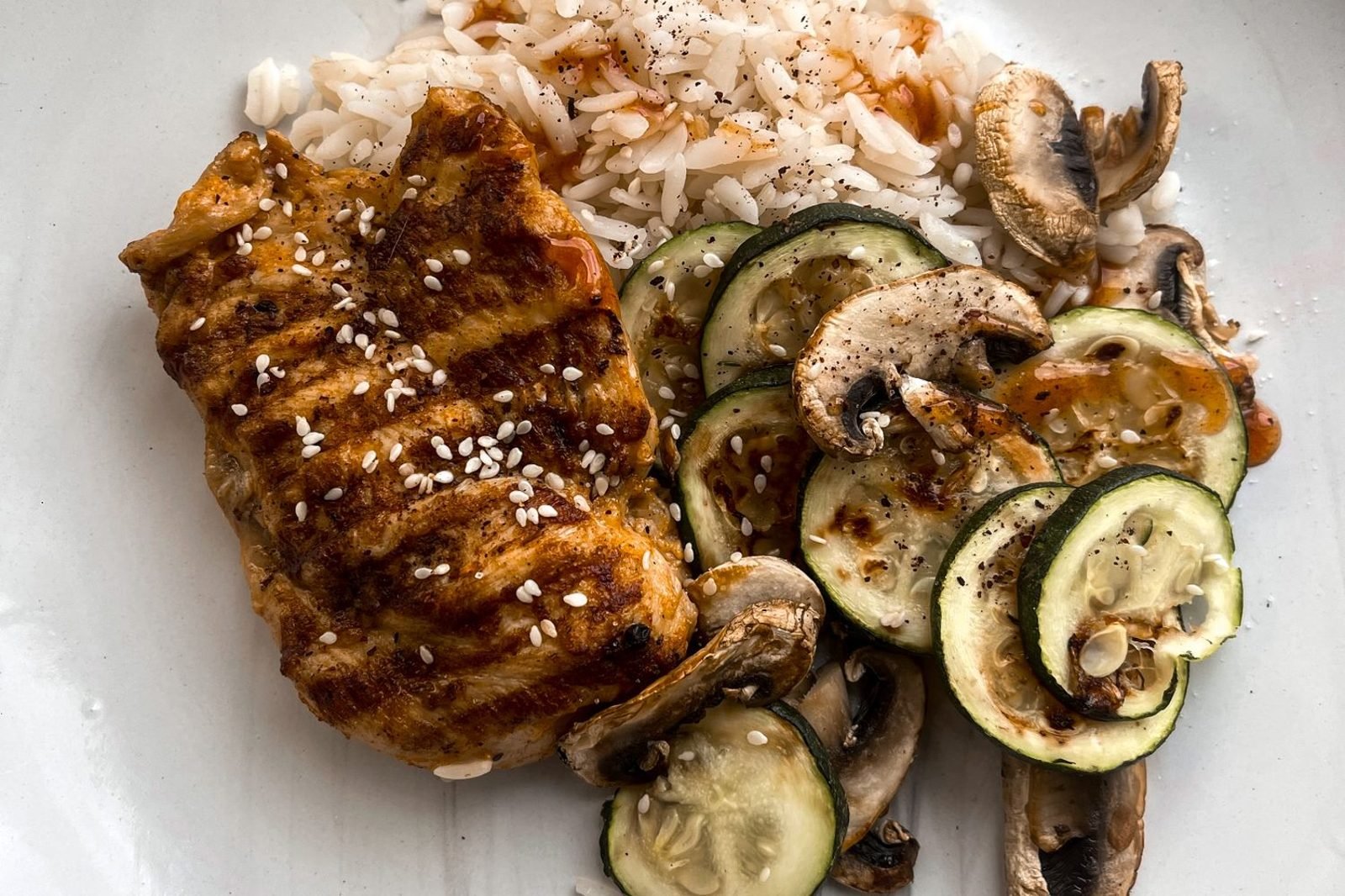 Athlete eating a pre-competition meal with carbohydrate-focused plate two hours before an event