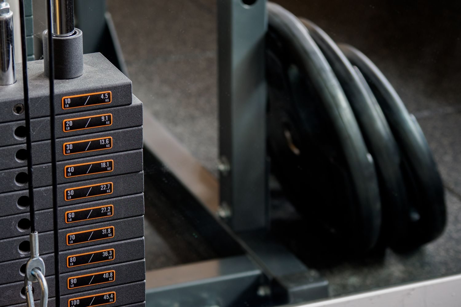 Close-up of a gym weight stack machine used for beginner-friendly resistance training