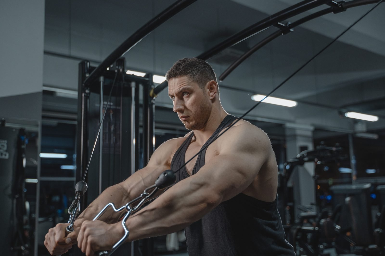 Man performing a cable core exercise in the gym