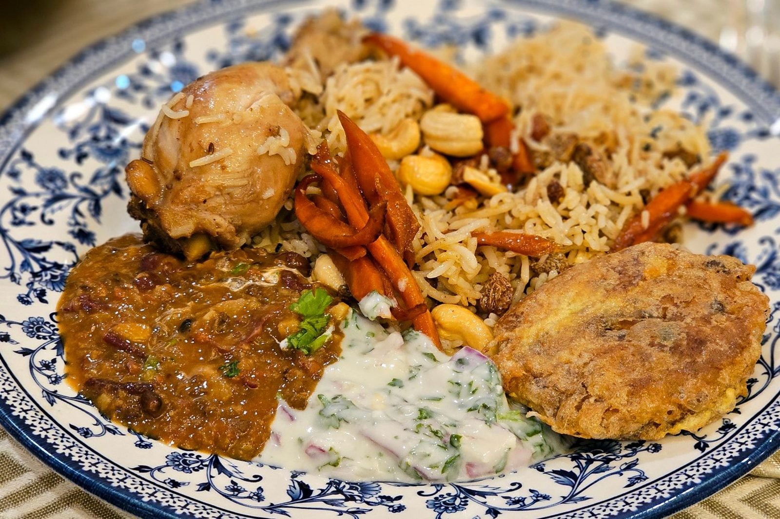 Plate with grilled chicken, lentils, eggs, and leafy greens representing a high-protein daily meal for men