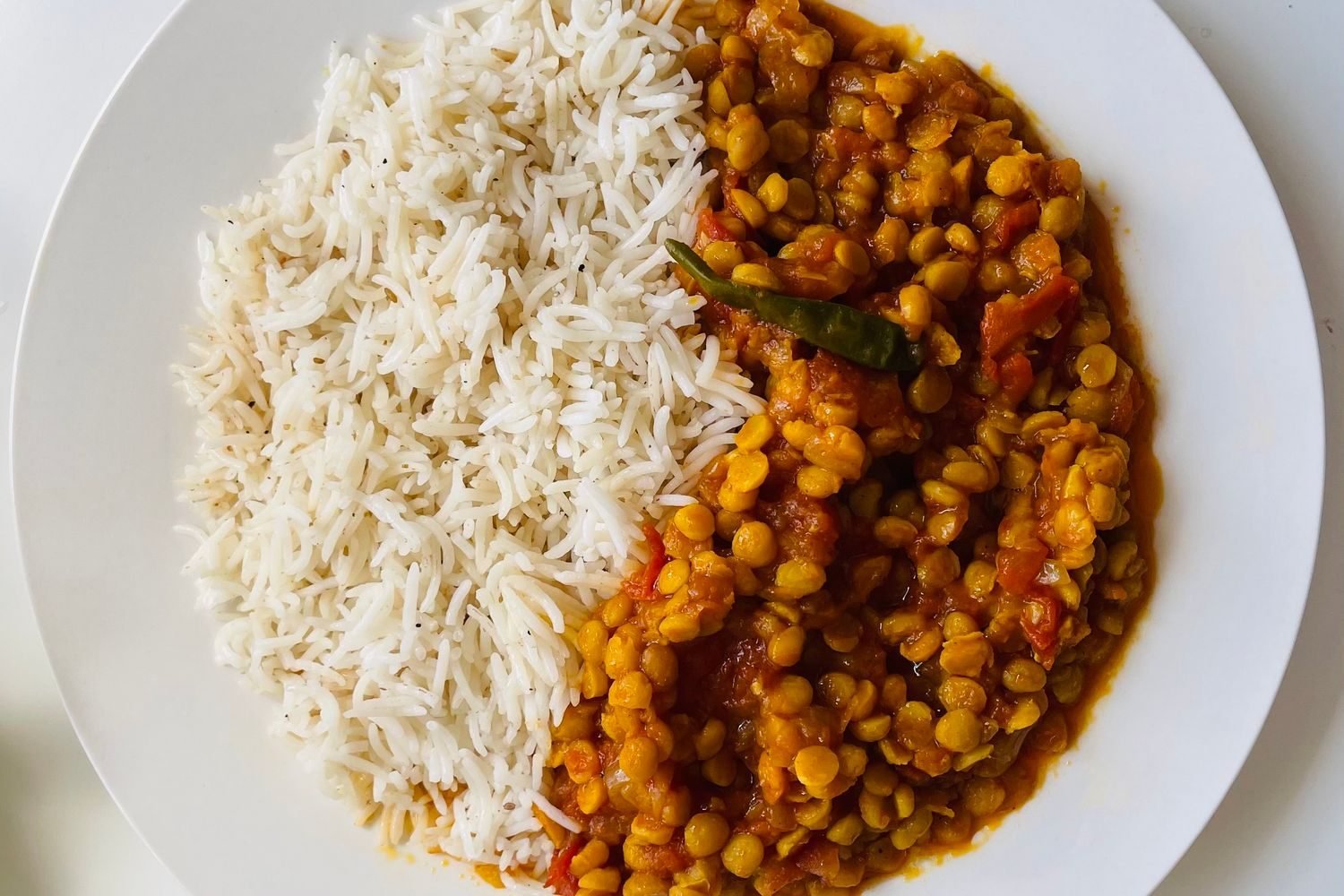 Home-cooked low-sodium Indian meal with brown rice, dal, and sautéed vegetables for hypertension management