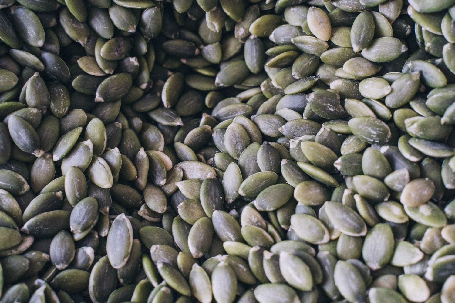 Zinc-rich and antioxidant foods for male fertility including pumpkin seeds, citrus, nuts, and leafy greens