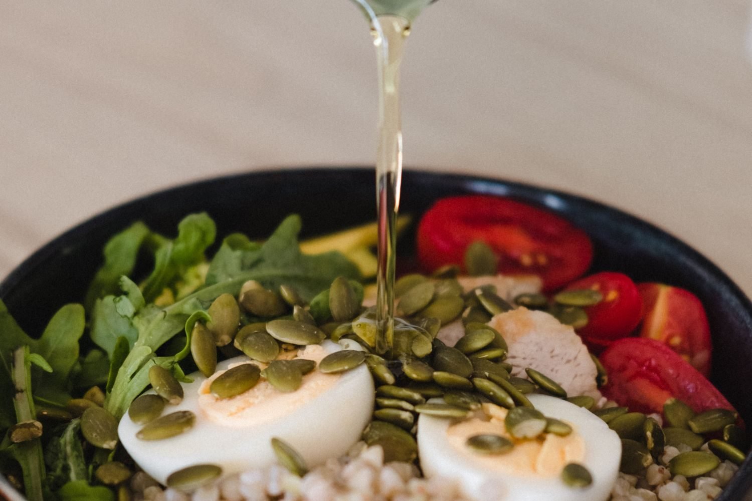 Balanced fertility-friendly plate with vegetables, whole grains, olive oil, and lean protein