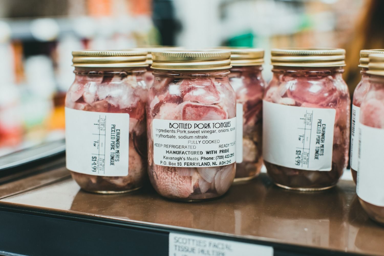 Processed foods high in hidden sodium including deli meat, canned soup, and frozen pizza