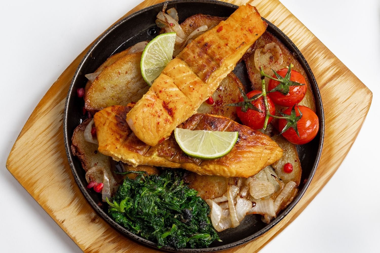 Plate of salmon, vegetables, and whole grains representing a triglyceride-friendly meal