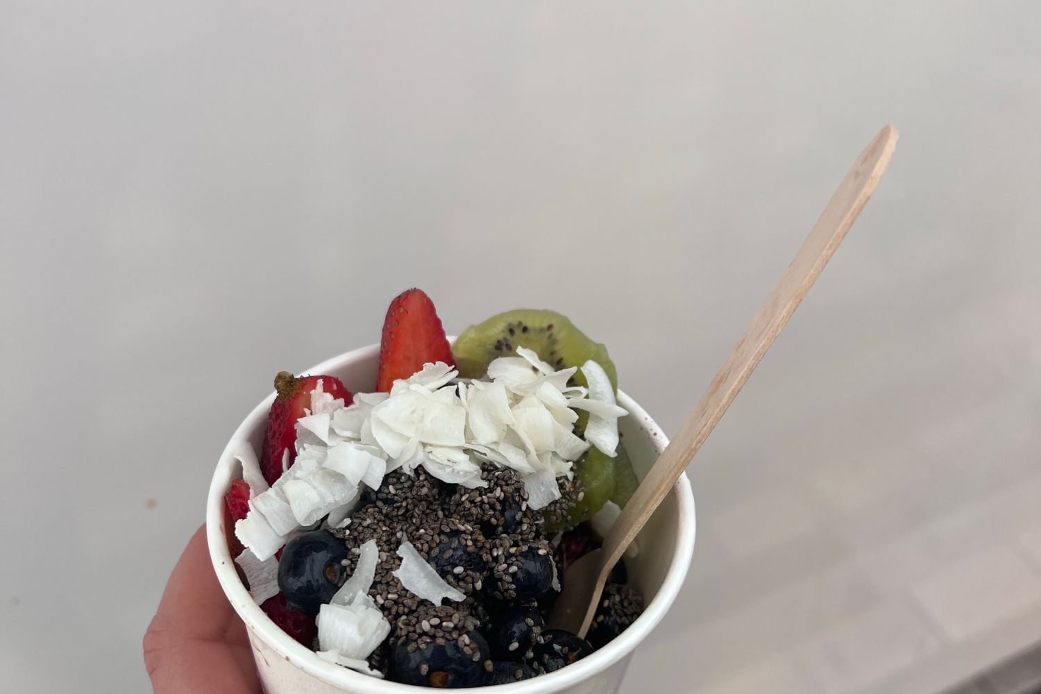 Nutrition label on a flavored yogurt cup showing added sugar content per serving