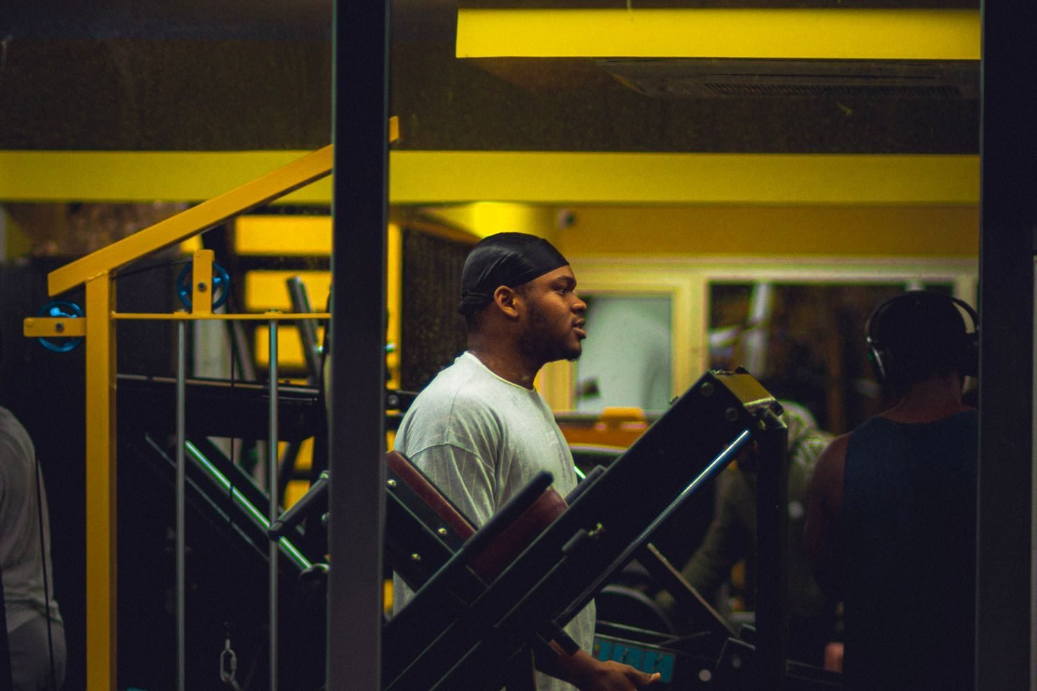 Man training in the gym in the evening