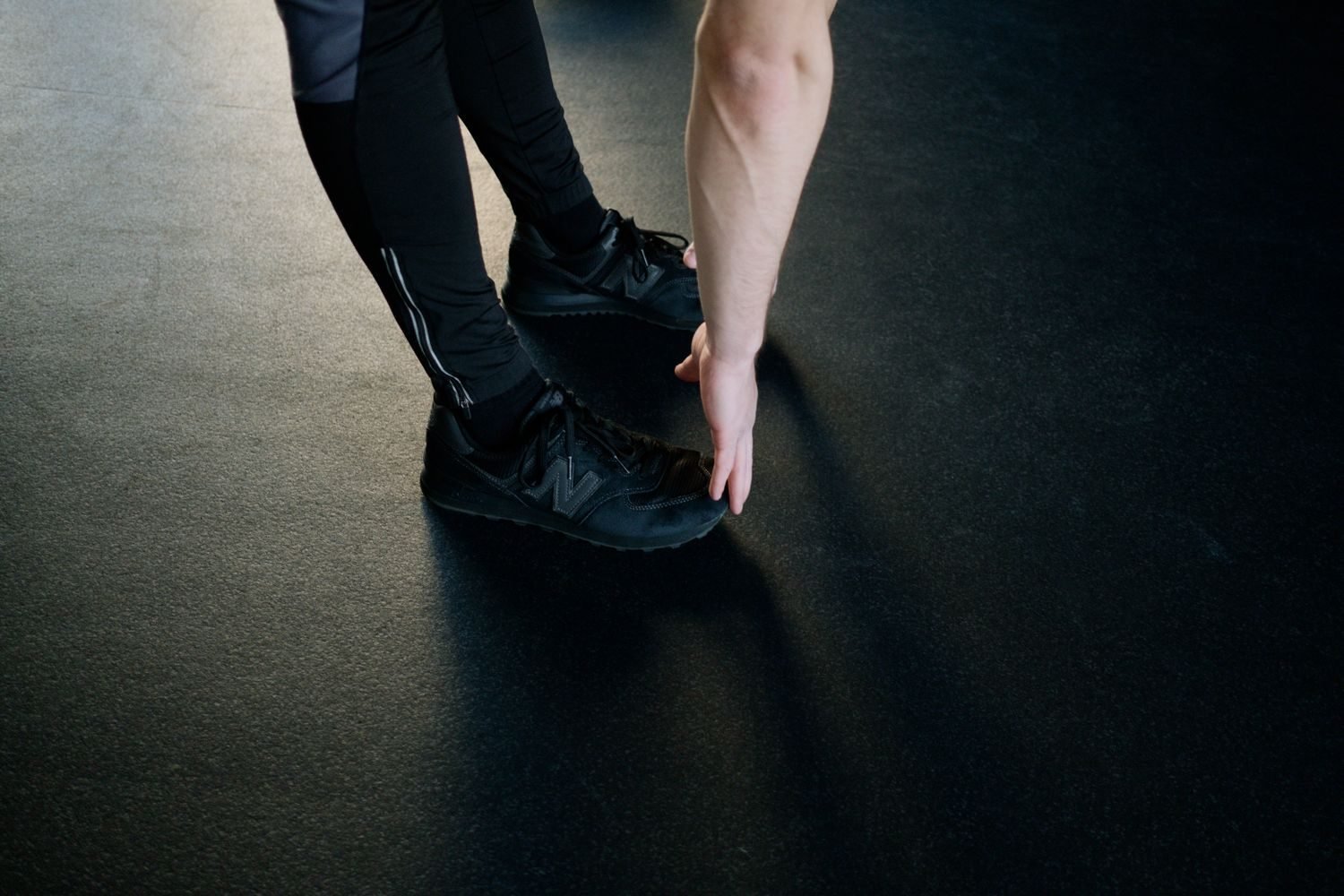 Person stretching their hamstrings during a gym cool-down