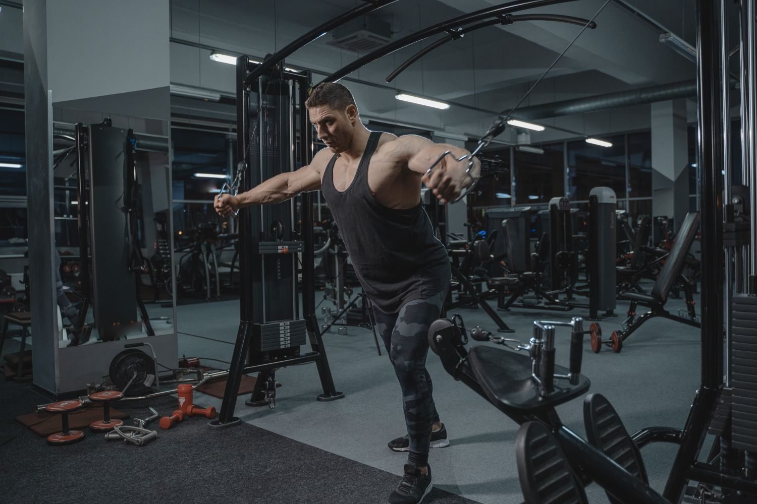Man using a cable machine during a gym workout