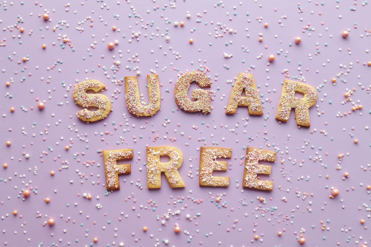 Sugar-free products and a bowl of white sugar alcohol crystals next to a xylitol label