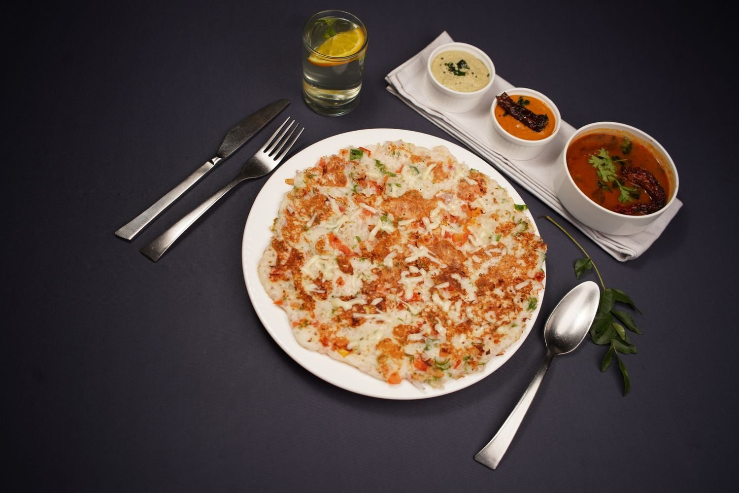 Besan chilla with vegetables and mint chutney served as a heart-smart Indian breakfast