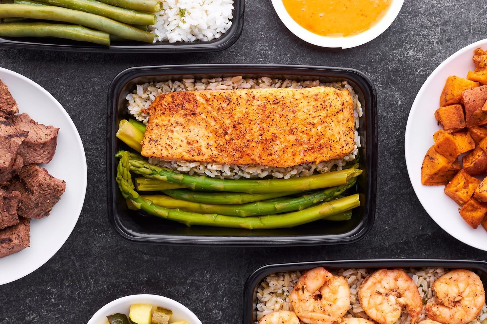 Person planning balanced meals with lean protein, vegetables and whole grains instead of relying on weight loss herbs and supplements