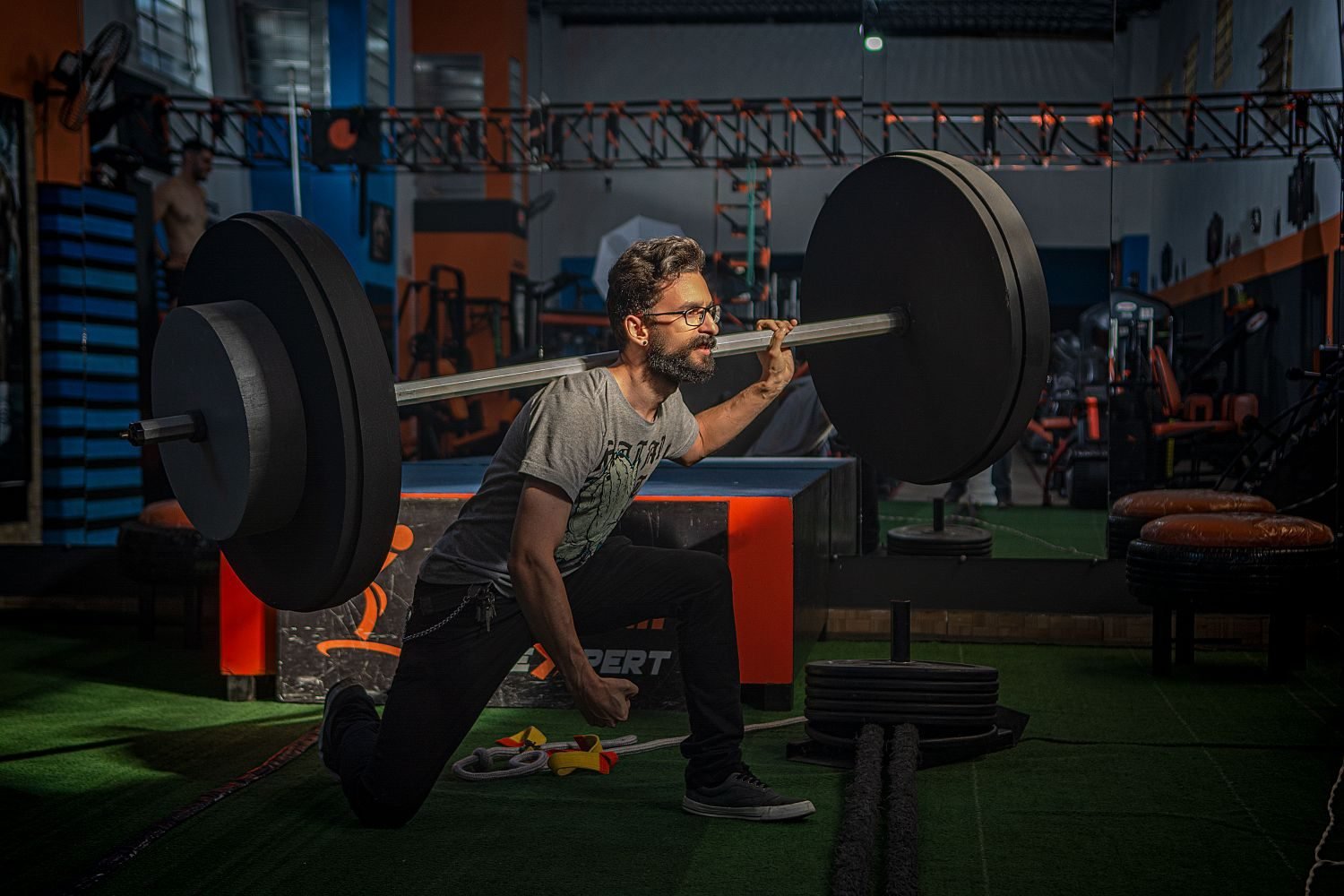 Person doing a resistance training exercise in a gym as part of a structured weight gain plan