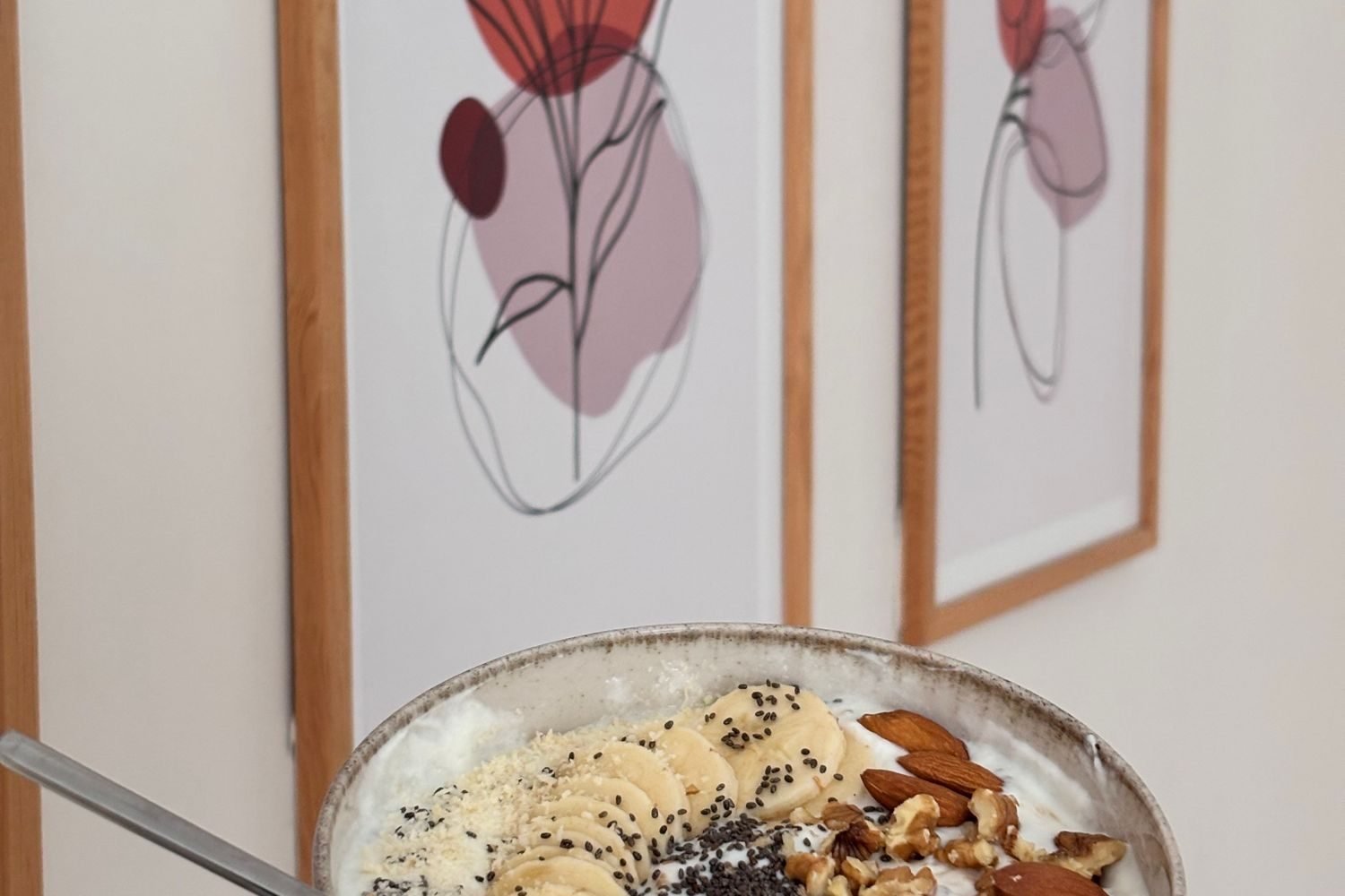 Bowl of Greek yogurt topped with almonds, walnuts and chia seeds as a high protein breakfast