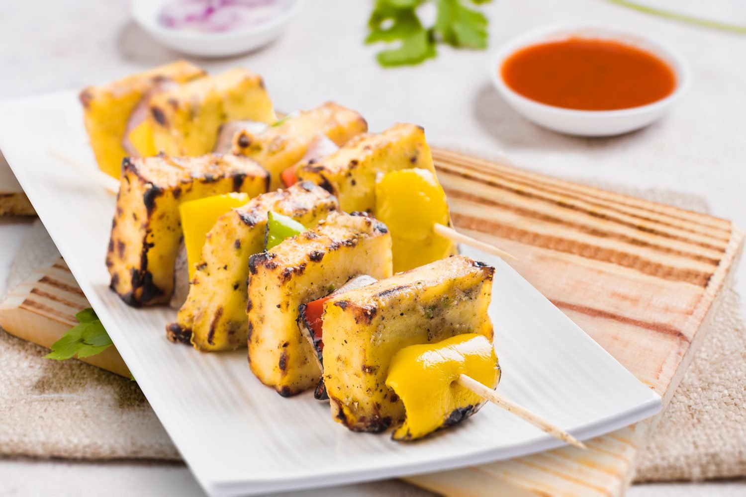 Paneer tikka bites and sprouts chaat served in bowls as high protein Indian snack options
