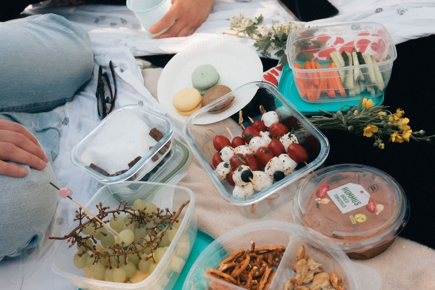 Weekly meal prep containers with edamame, cottage cheese, and cut vegetables as high protein snack stock