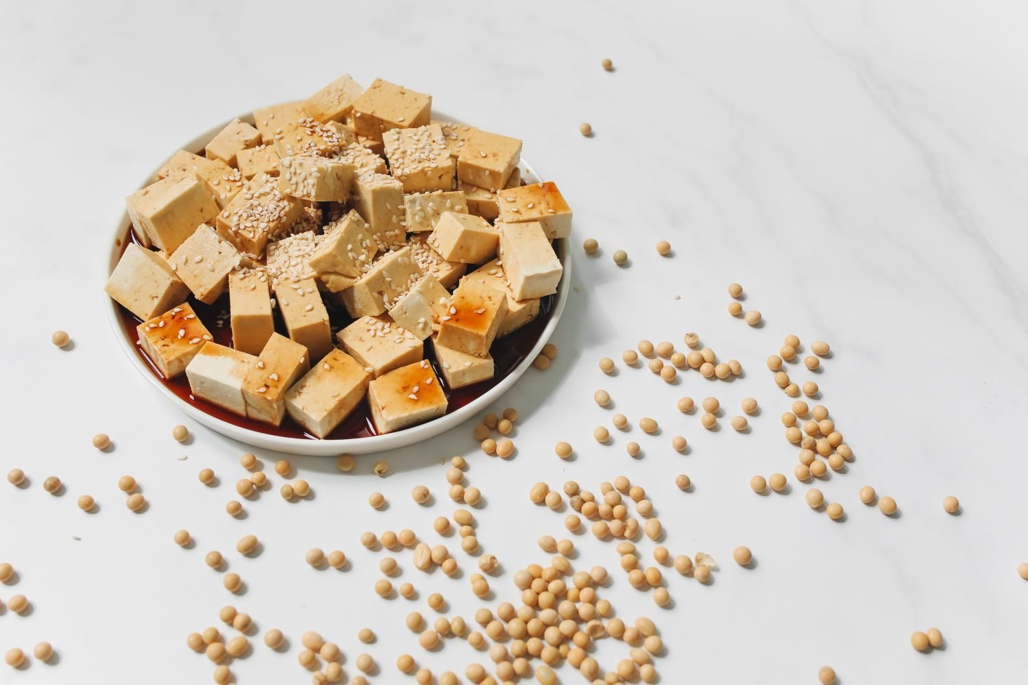 Soy chunks, tofu cubes, and mixed nuts and seeds as plant-based protein sources