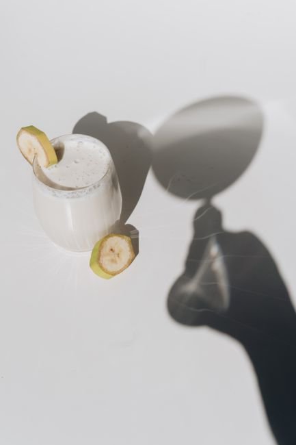 Homemade banana smoothie drink in a glass