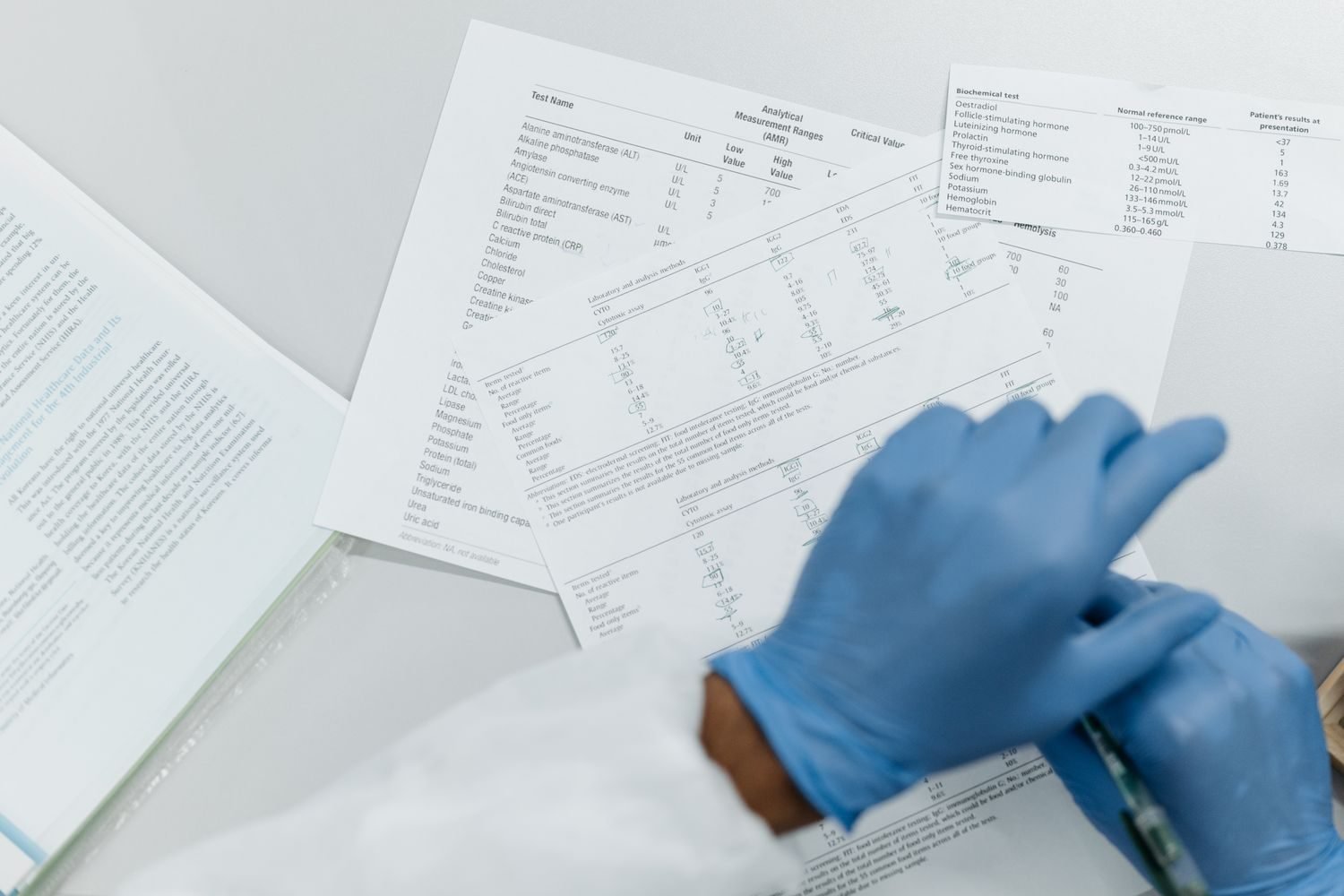 Nutritionist reviewing HbA1c lab results and glucose trends with a diabetes patient during a consultation