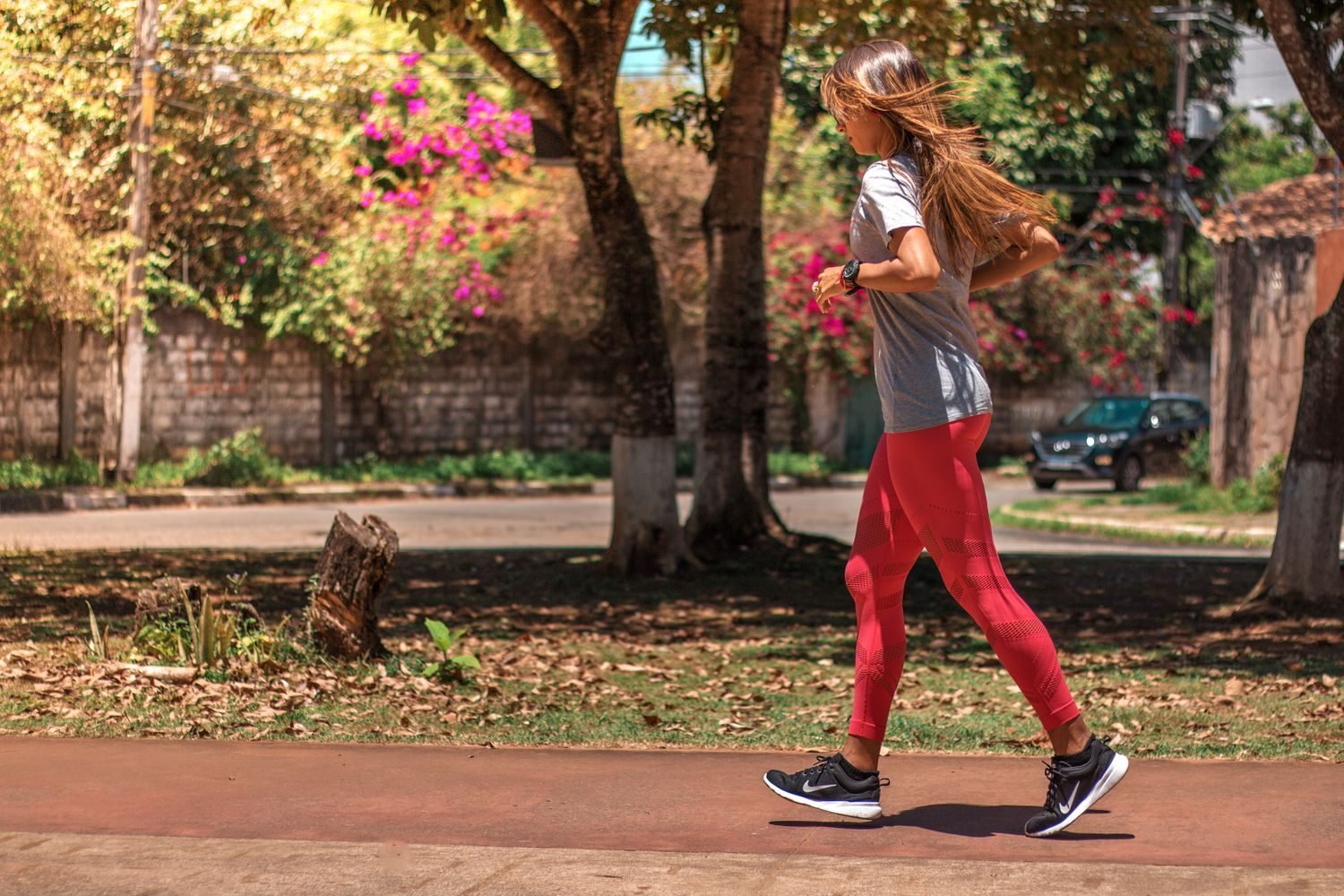 Person going for an outdoor run as part of a consistent weekly exercise routine
