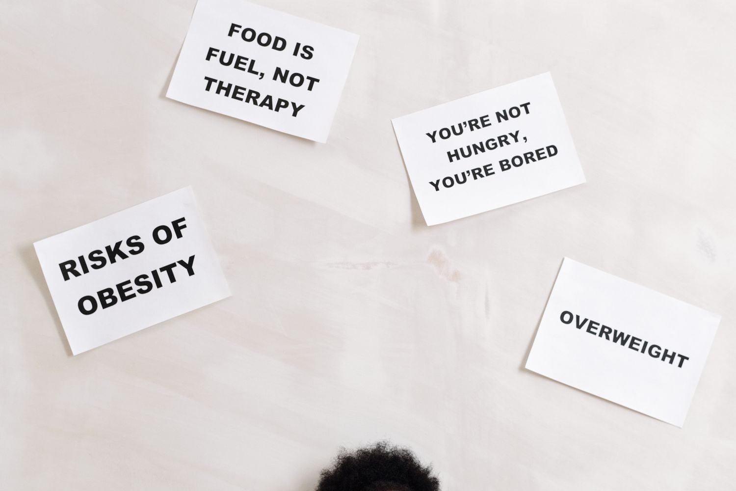 Person feeling stressed about strict food rules and all-or-nothing dieting mindset