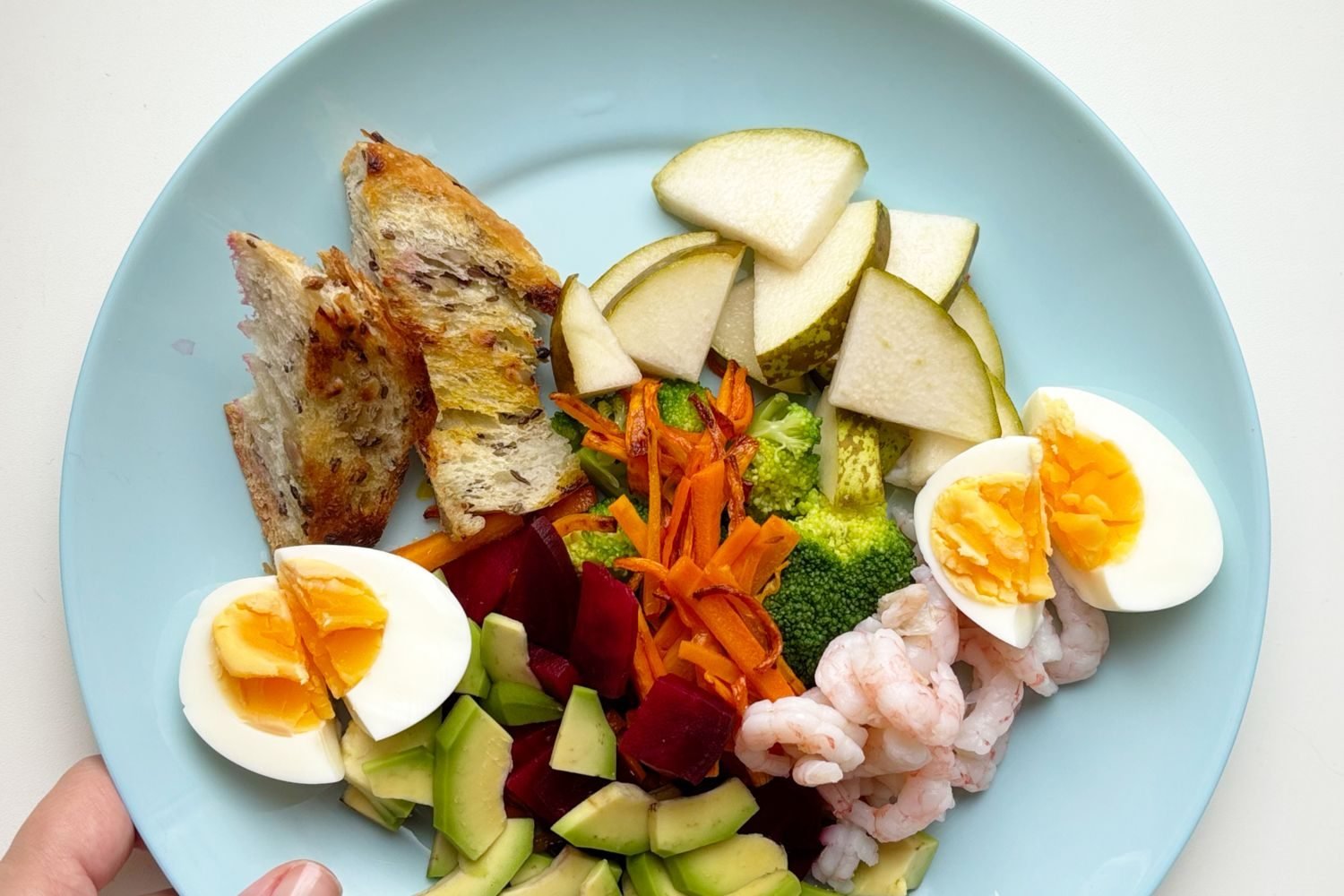 Reference chart showing infant nutritional requirements by month for calories, protein, iron, and vitamin D