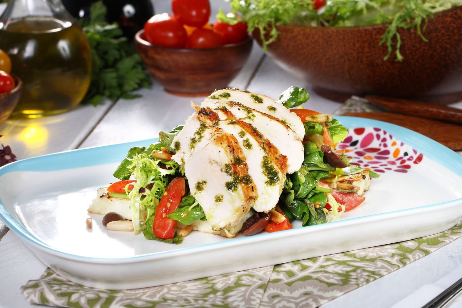 Colorful low-carb meal with grilled fish, leafy greens, nuts and olive oil representing a balanced approach