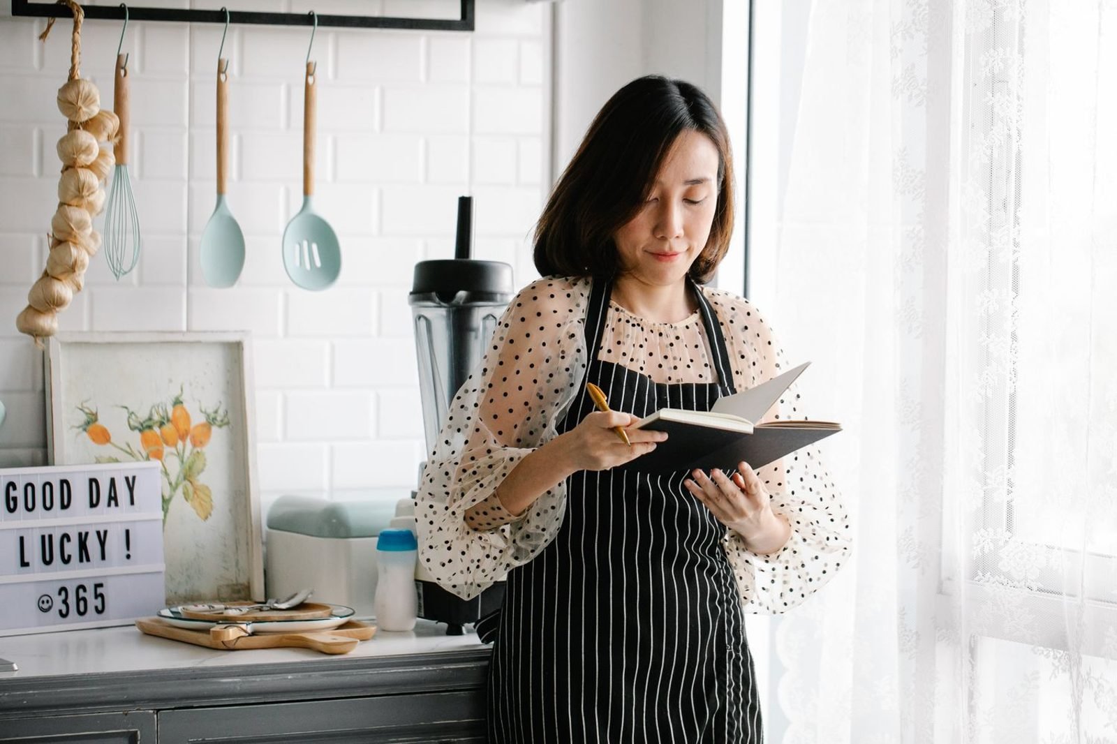 Overwhelmed home cook surrounded by too many recipe cards, contrasted with a simple organized weekly meal plan