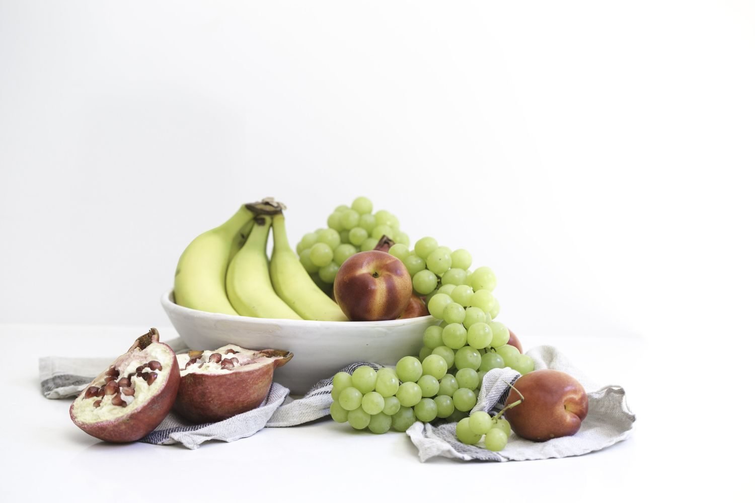 Fresh fruit bowl with pomegranate, banana, and coconut water for Navratri fasting hydration