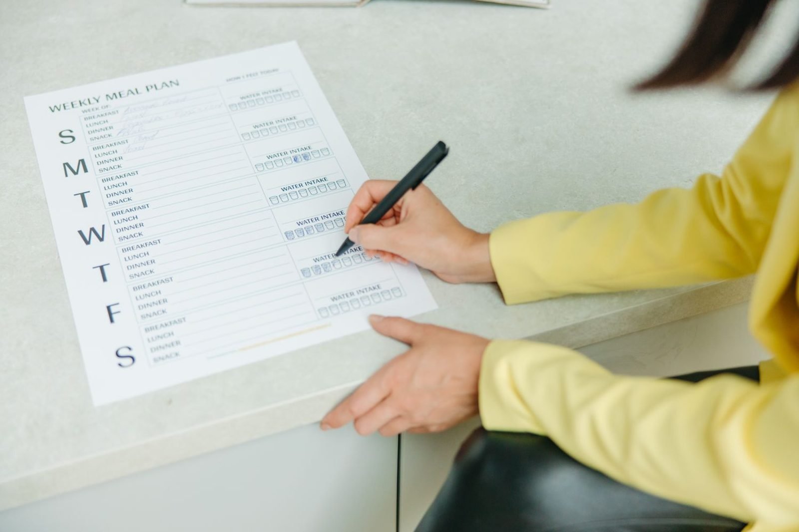 Person comparing nutrition professional credentials and questions before booking a consultation