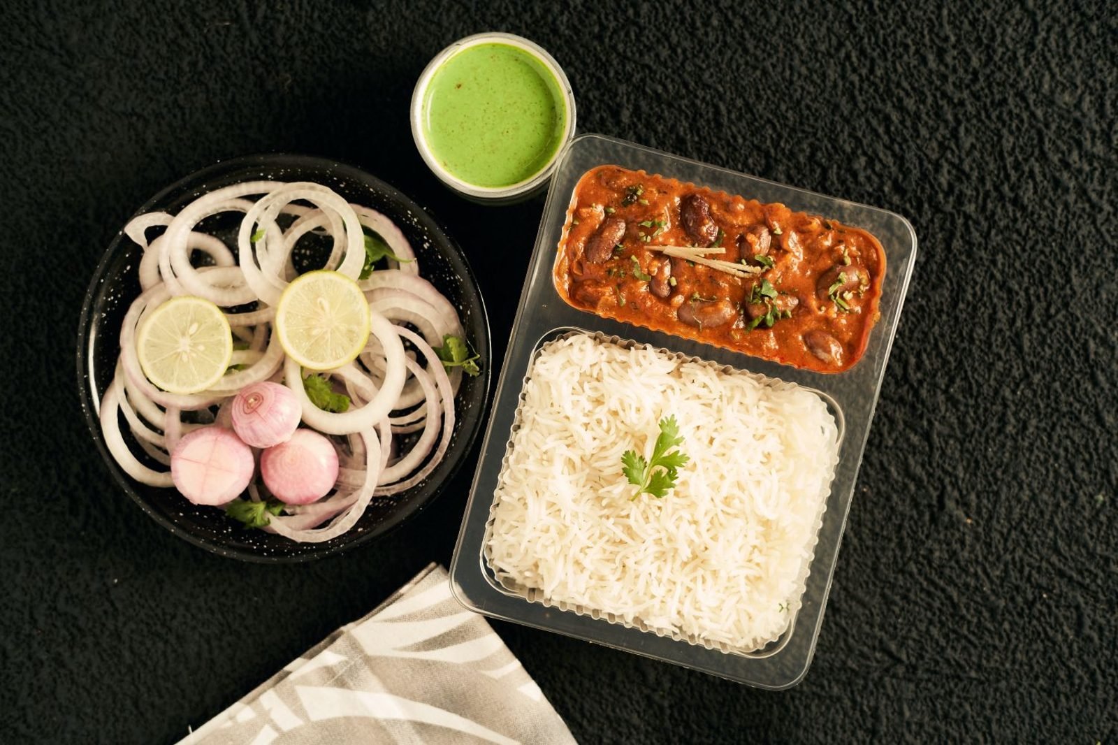 Child's school tiffin box packed with roti, vegetables, paneer, and fruit for a balanced lunch