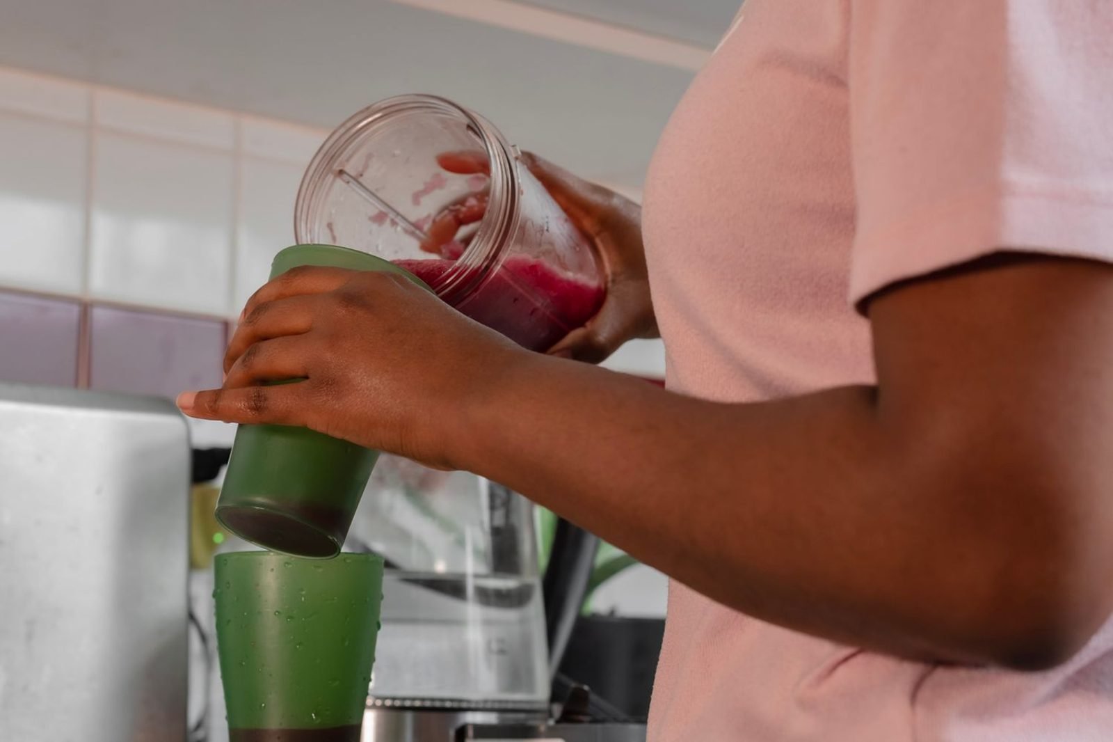 Protein shake and powder next to fresh fruit and vegetables for a balanced weight loss nutrition approach