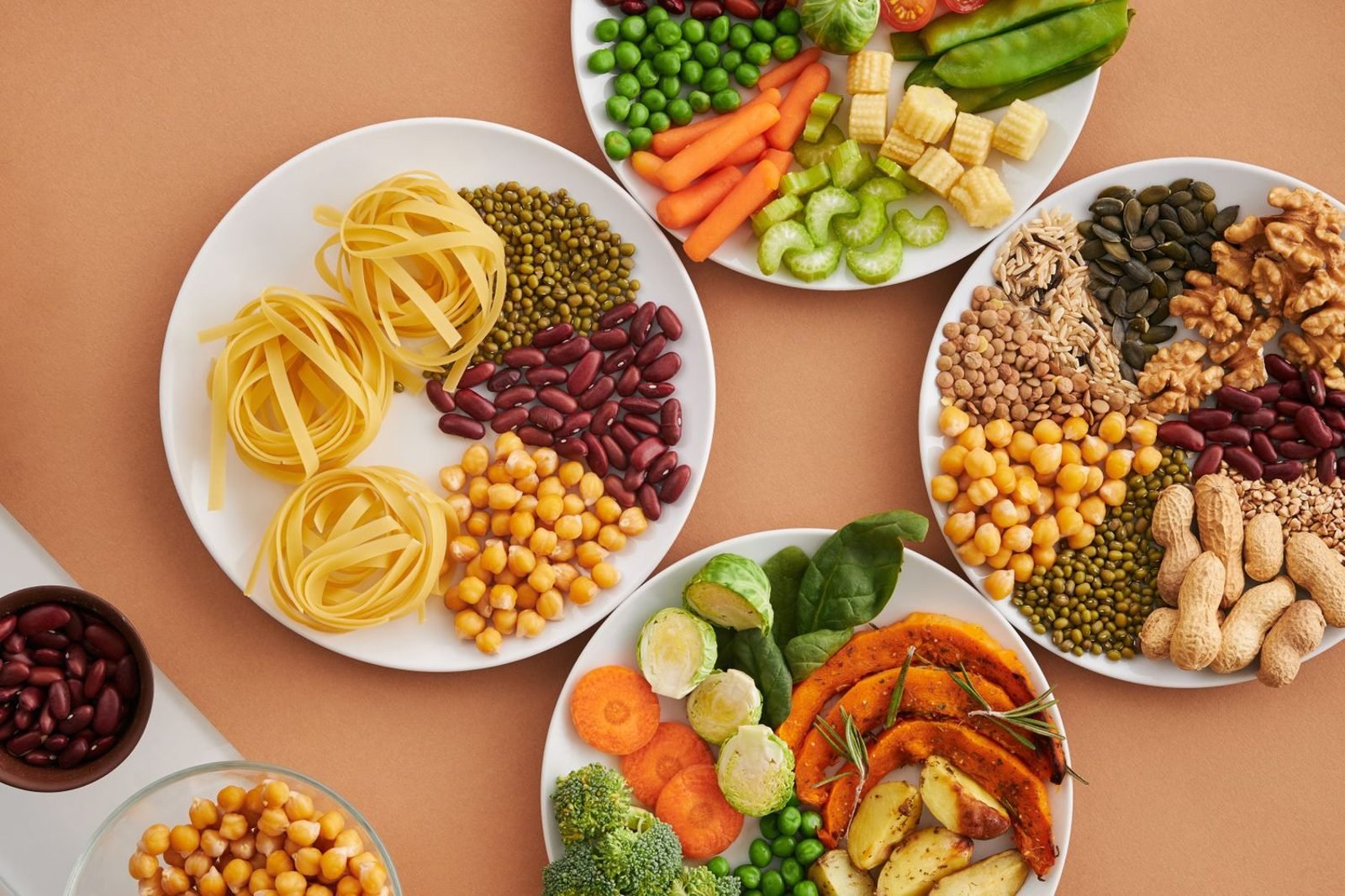 Plate of iron-rich foods including spinach, lentils and nuts for correcting nutritional deficiency