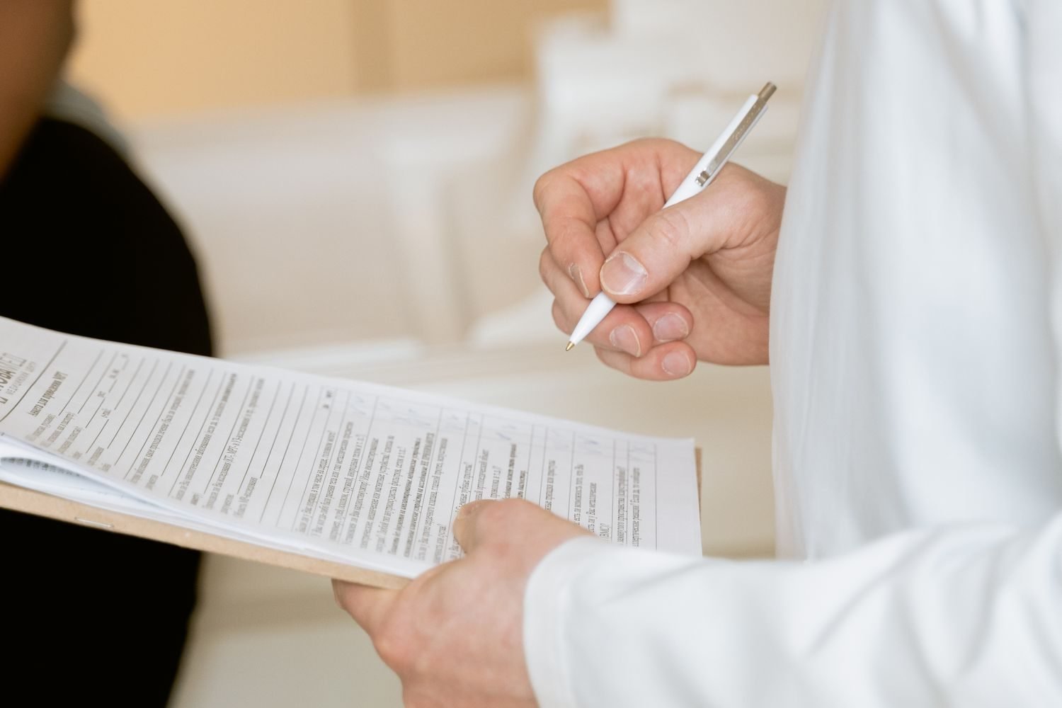 Doctor reviewing complete blood count lab report with a patient, pointing to MCV and ferritin values
