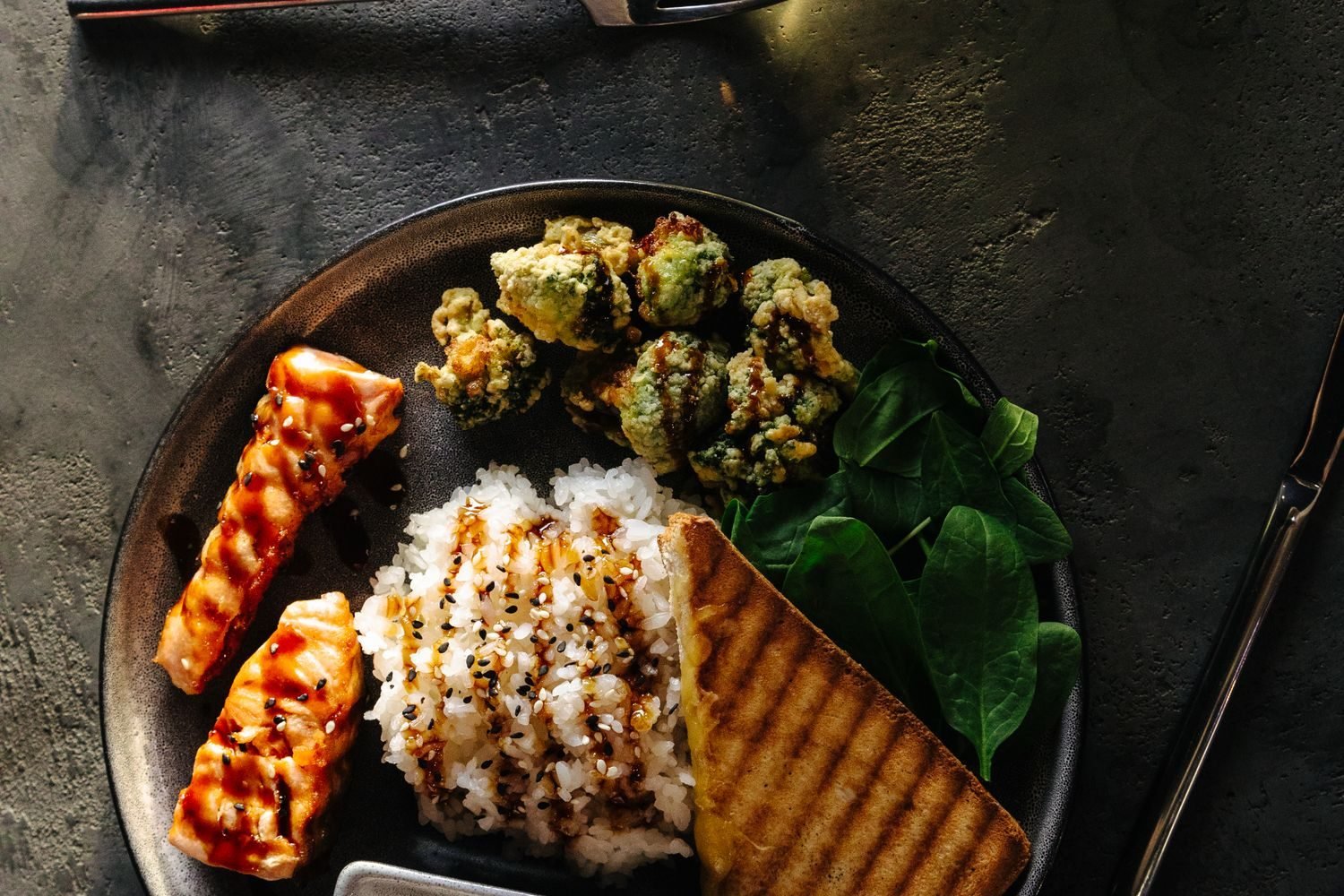 Balanced plate of protein, vegetables, and whole grains representing adequate nutrition for hair health