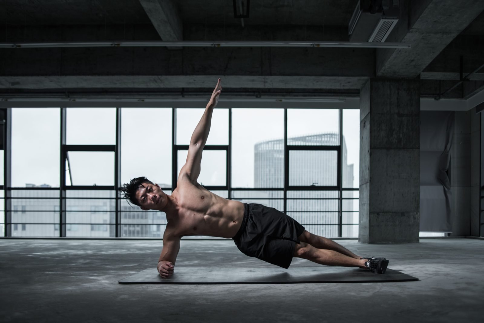Woman performing a side plank core exercise