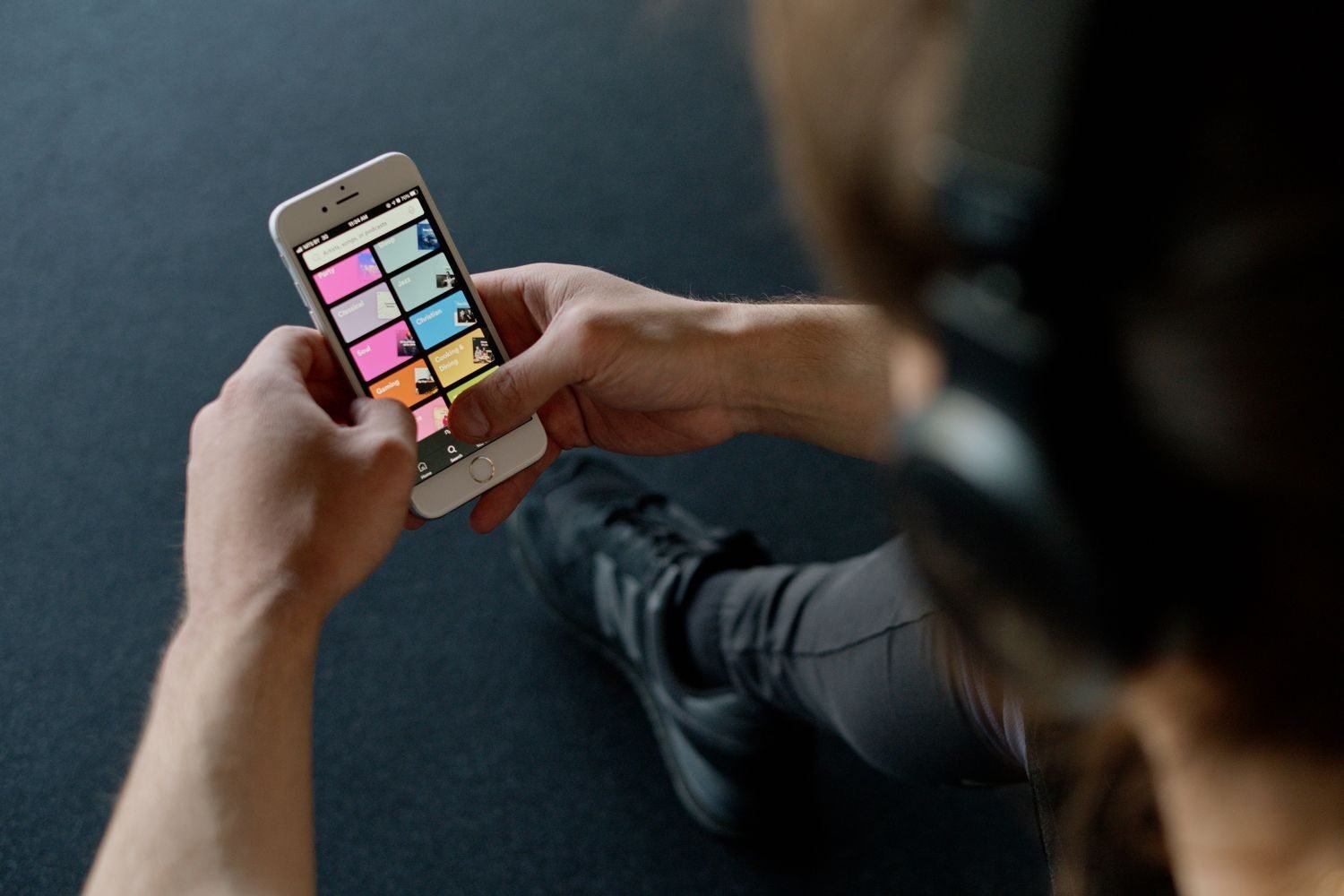 Person browsing a workout for women app on their phone
