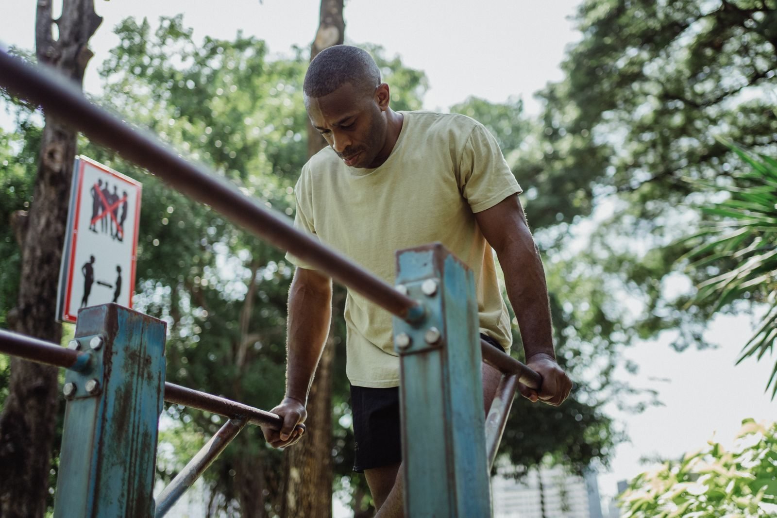Parallel bar dips performed outdoors as part of a double bar workout