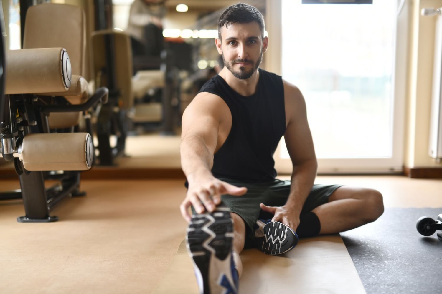 Stretching after a workout as part of a cool-down routine
