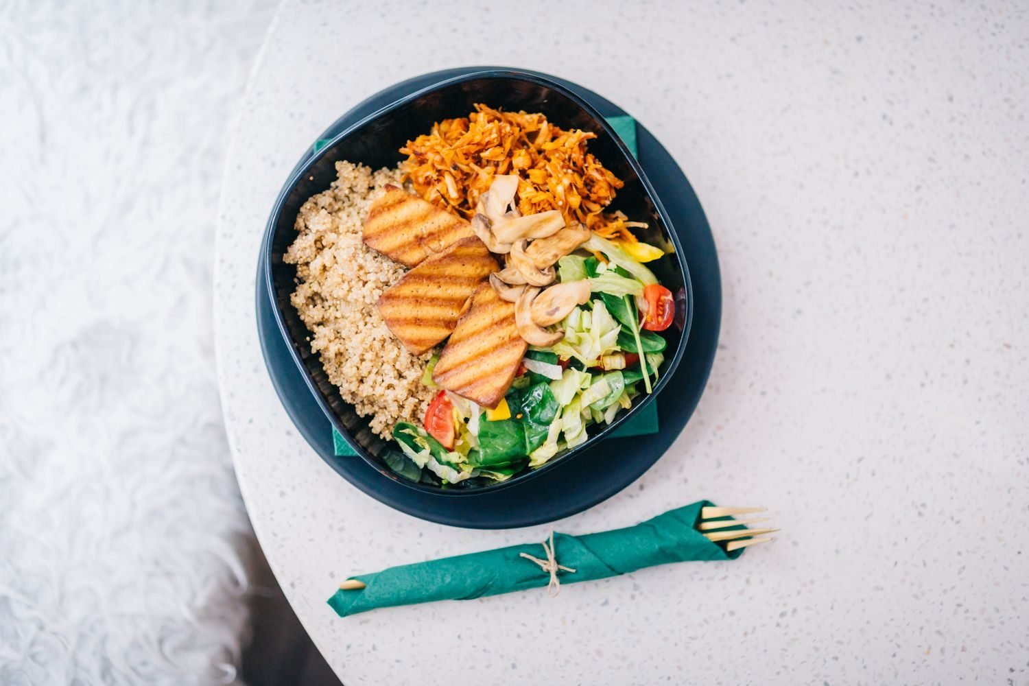 Plate of dal, rice, tofu, and quinoa illustrating complete plant protein combinations for a vegan diet