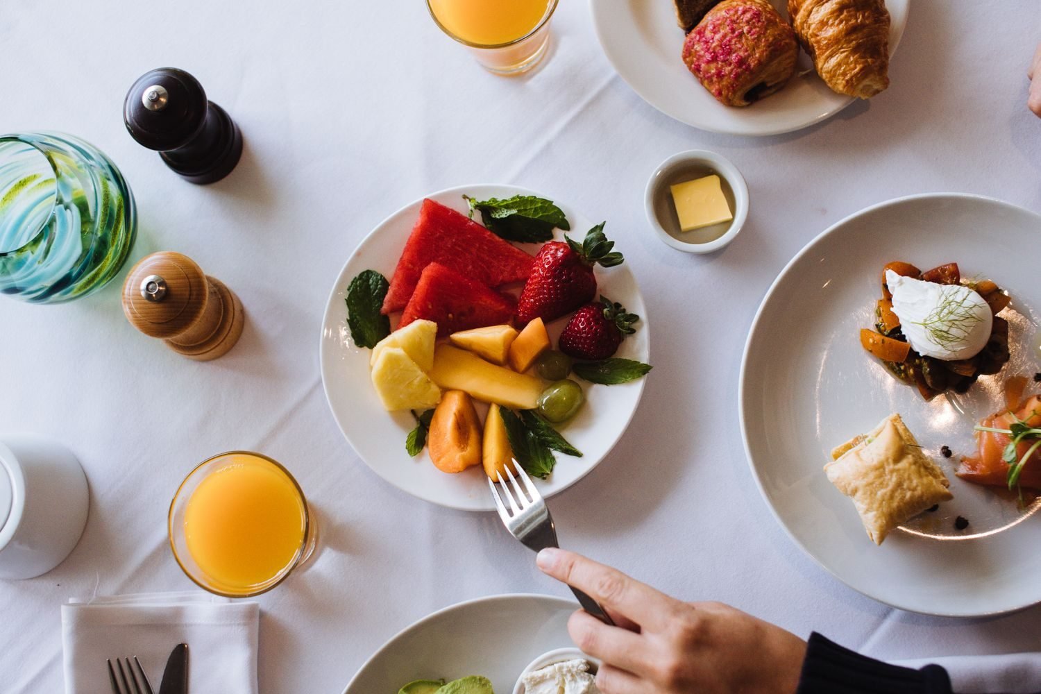 Overhead view of a colorful, balanced meal being eaten mindfully at a calm, uncluttered table