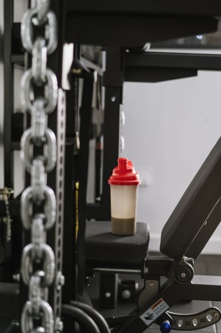Shaker bottle used to mix a pre-workout supplement at the gym