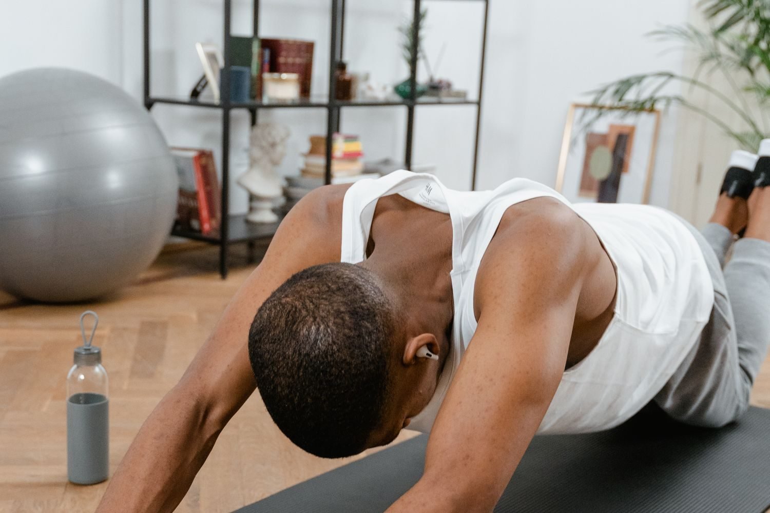 Man doing a plank exercise during a home workout