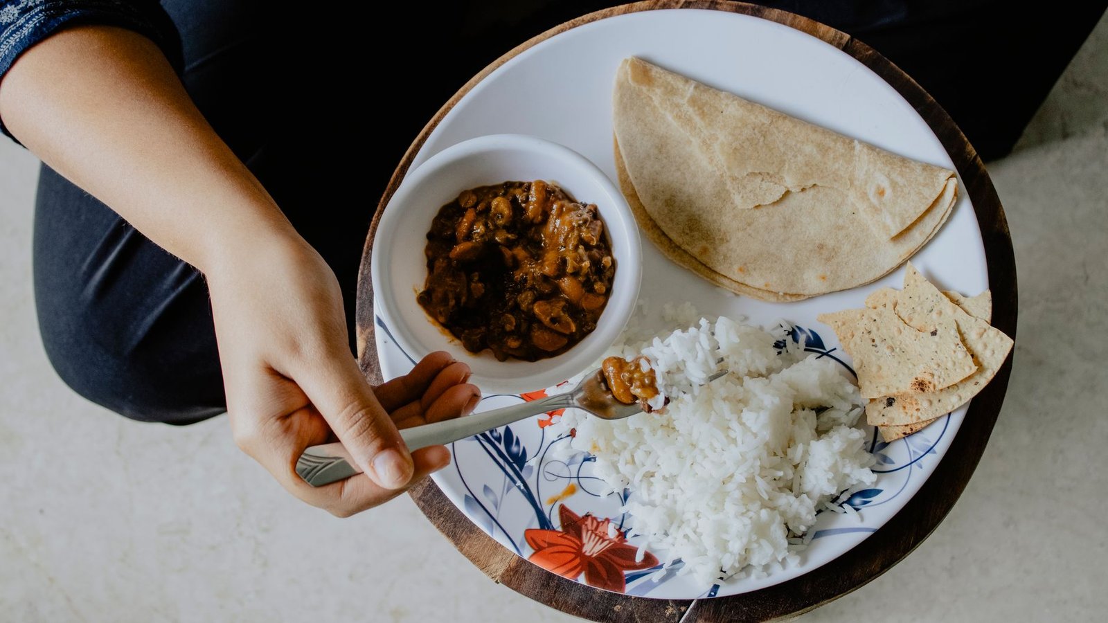 Balanced Indian plate of dal, rice and vegetables forming the base of a one-month female diet chart