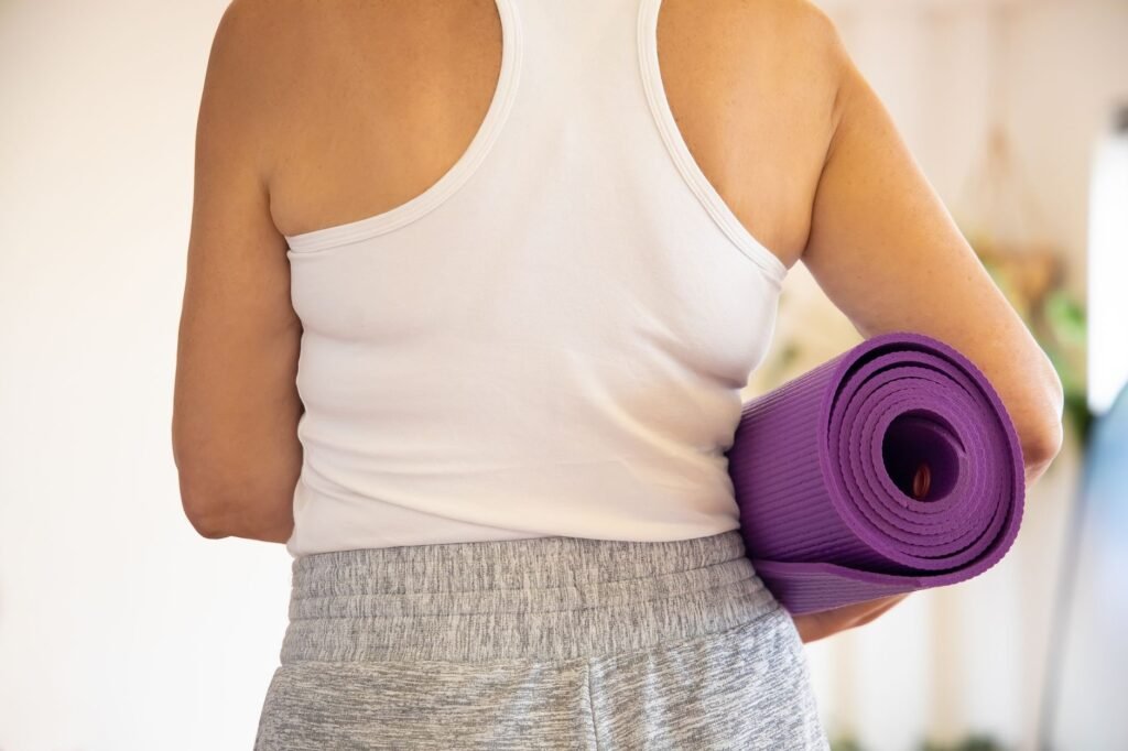 Woman performing yoga exercises as part of a weight loss routine